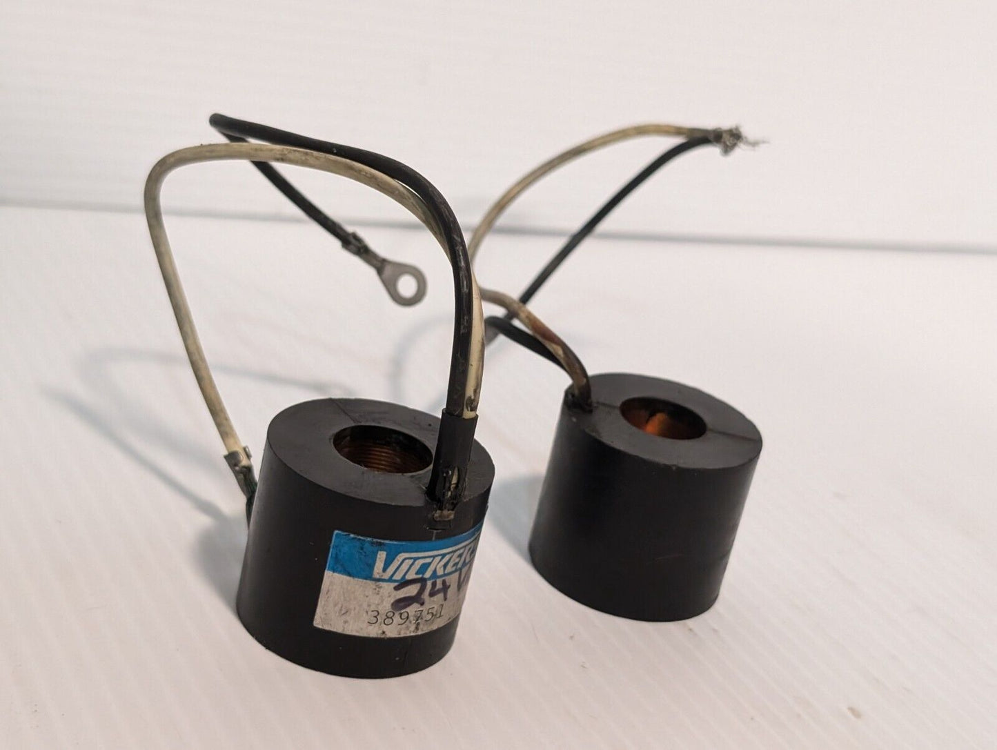 Vickers 389751 solenoid coil, 24V, and another presumably the same, but unmarked