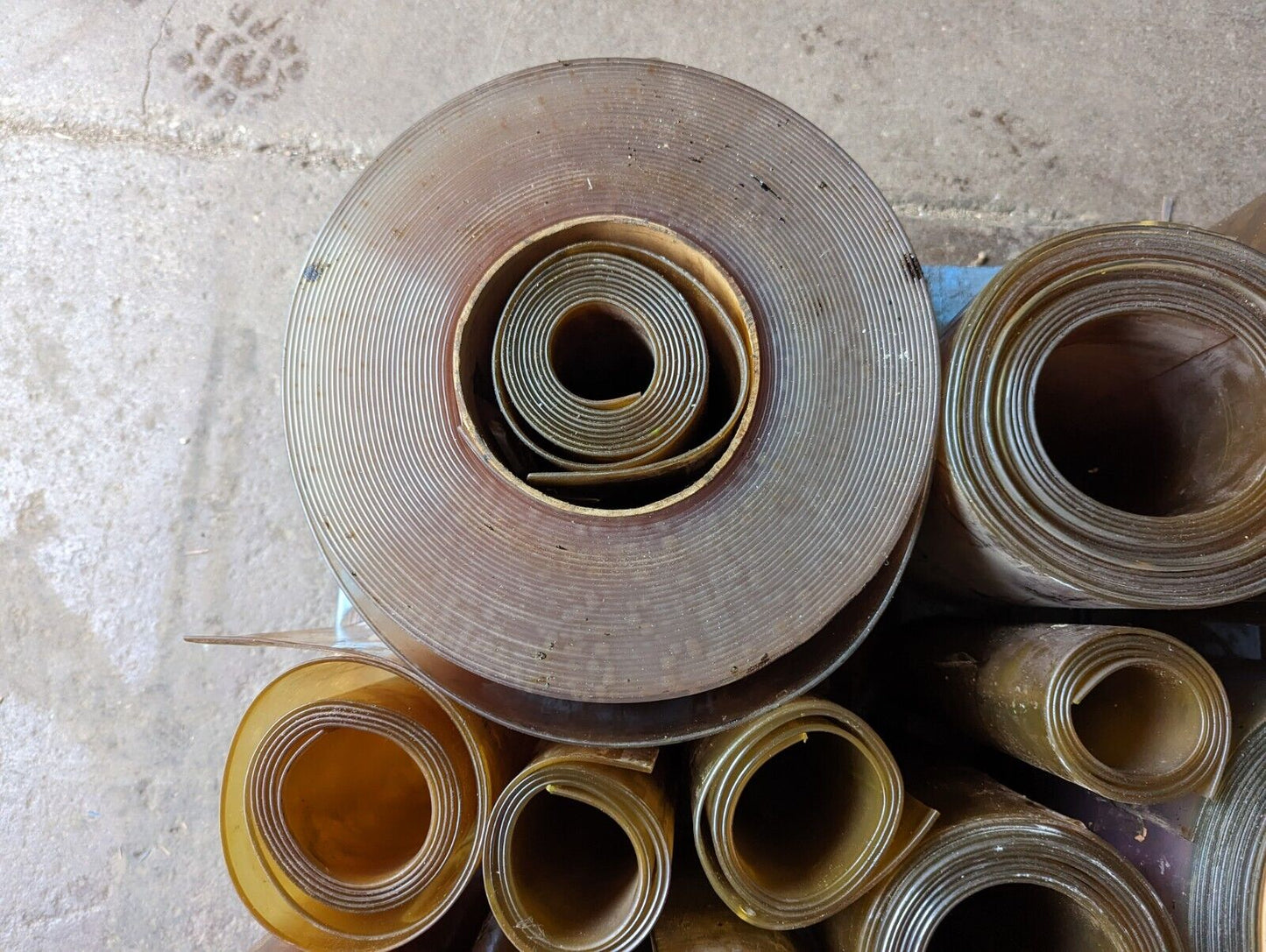 30in x 30in pallet full of 12 in wide plastic/PVC rolls as pictured