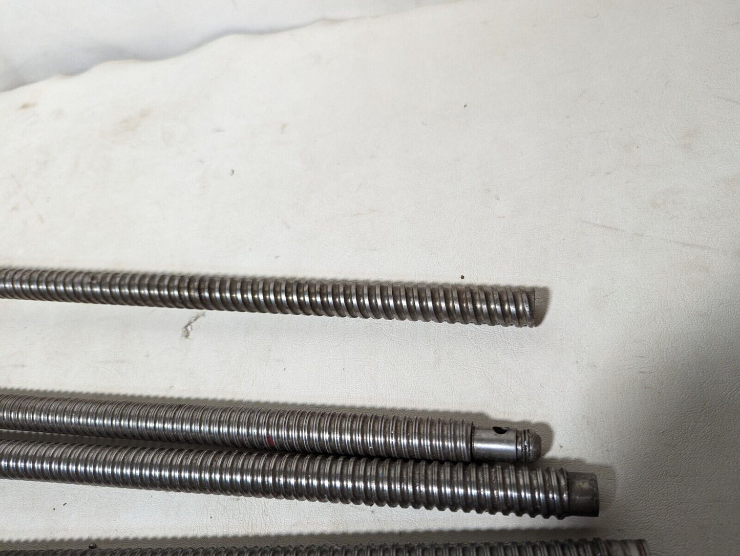 Lot of 4 feed screws, 3x 32 inches, 1x 36 inches long, plus some extras