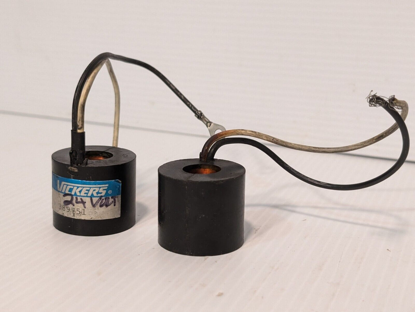 Vickers 389751 solenoid coil, 24V, and another presumably the same, but unmarked