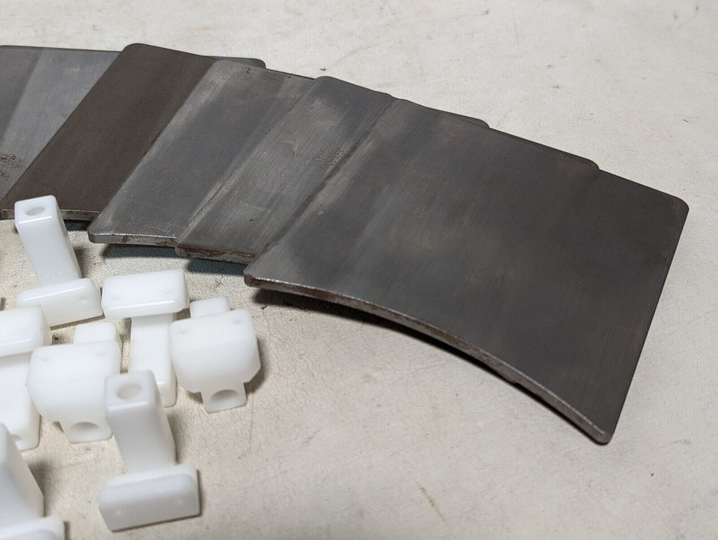 Signode 268362 track clips: twelve 5in by 4.25 in by 3/16 in steel plates