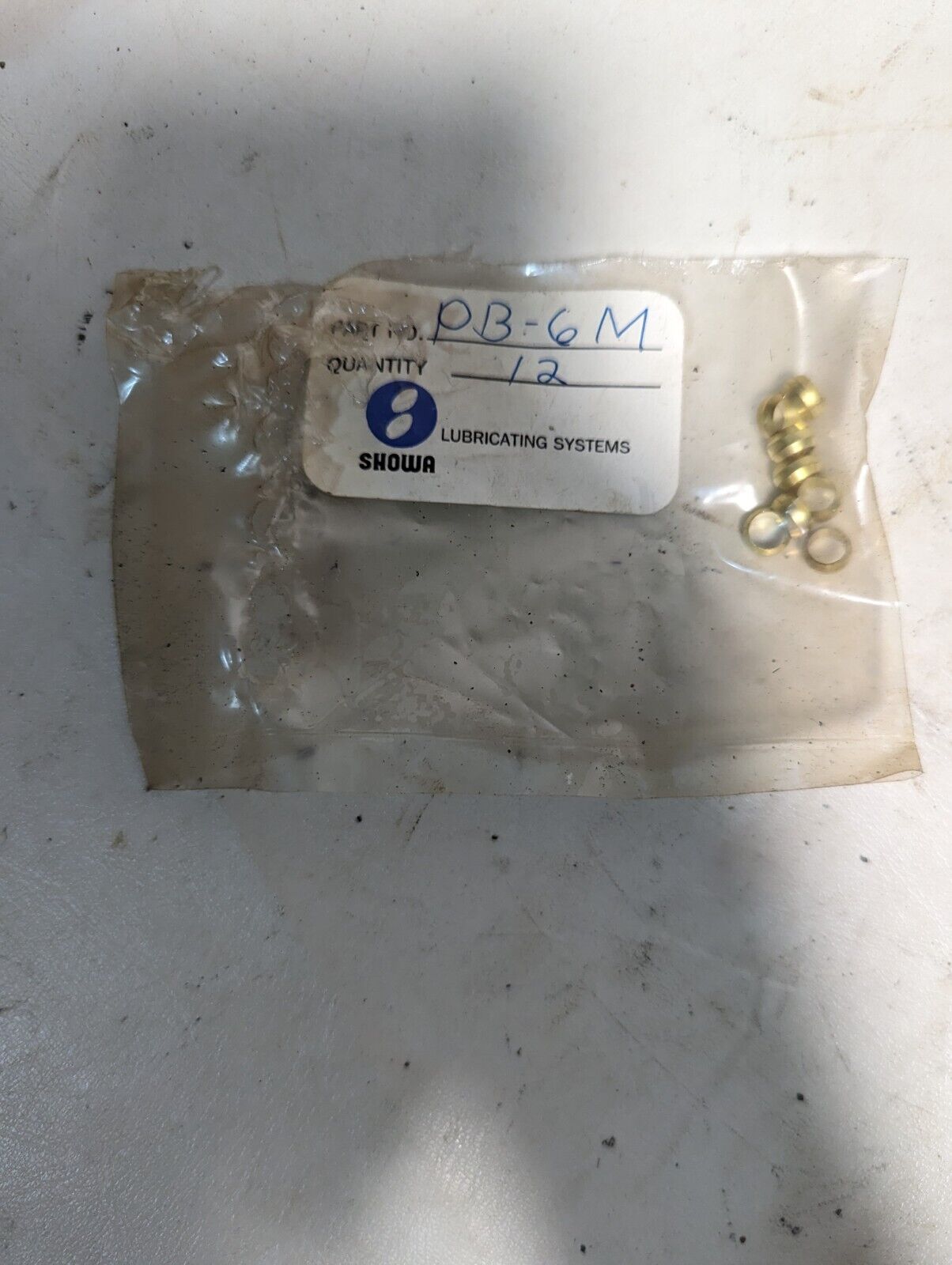 Lot of assorted Showa lubricating parts: two hoses, PB-6M, springs, PD-6M