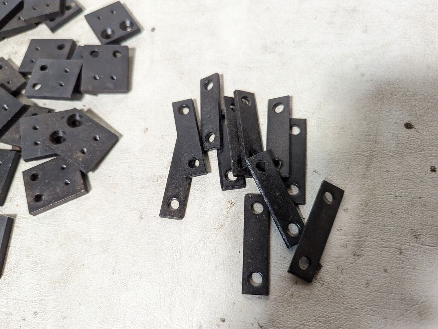 6.5+ pounds of flat metal bracket plates as pictured, 0.19 inches thick...
