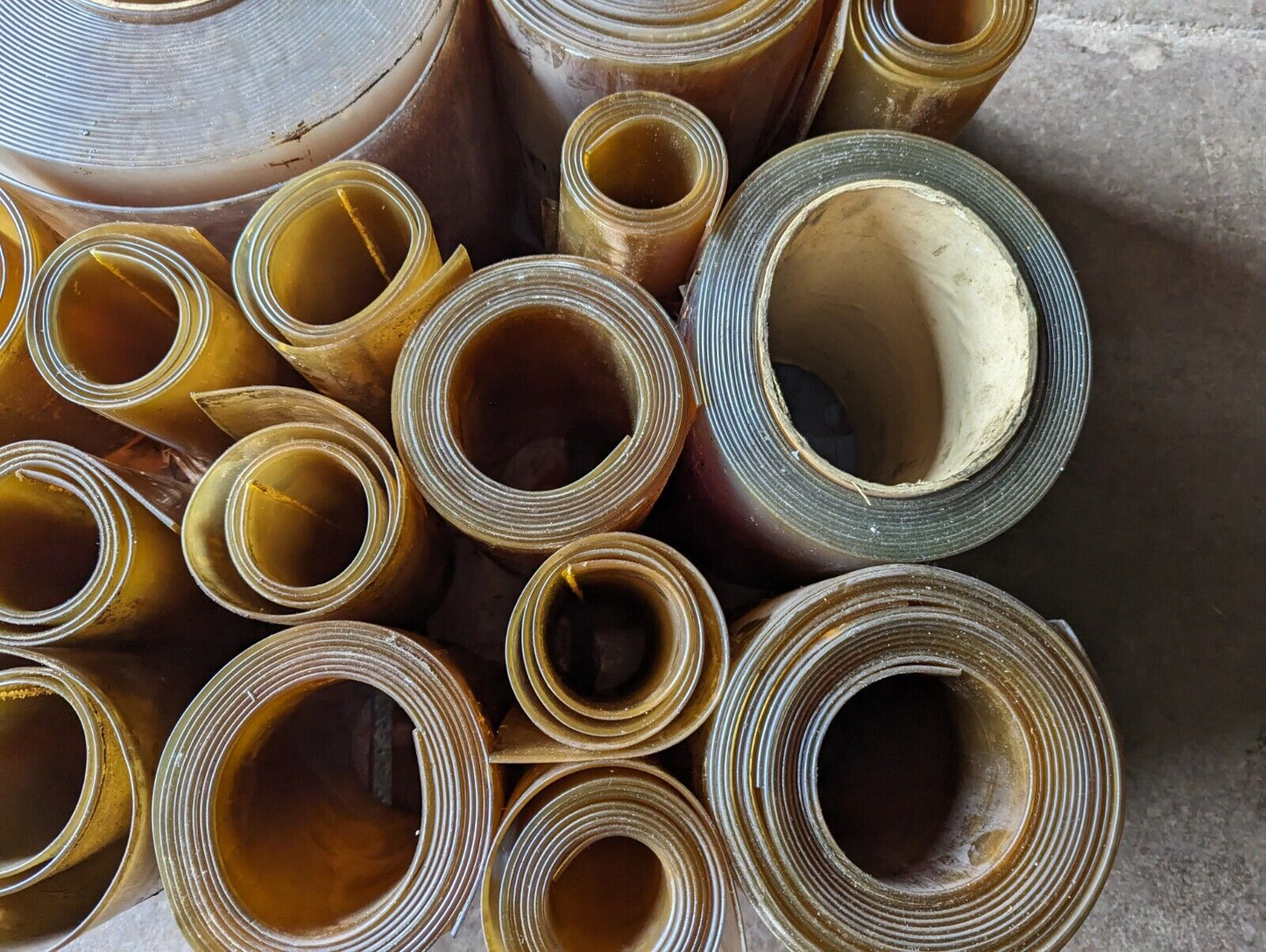 30in x 30in pallet full of 12 in wide plastic/PVC rolls as pictured