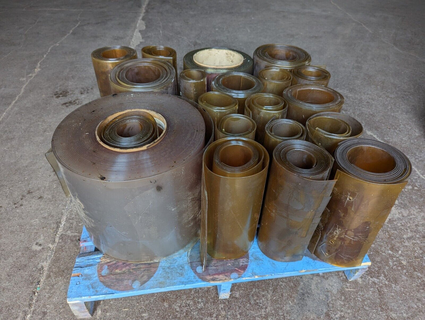 30in x 30in pallet full of 12 in wide plastic/PVC rolls as pictured