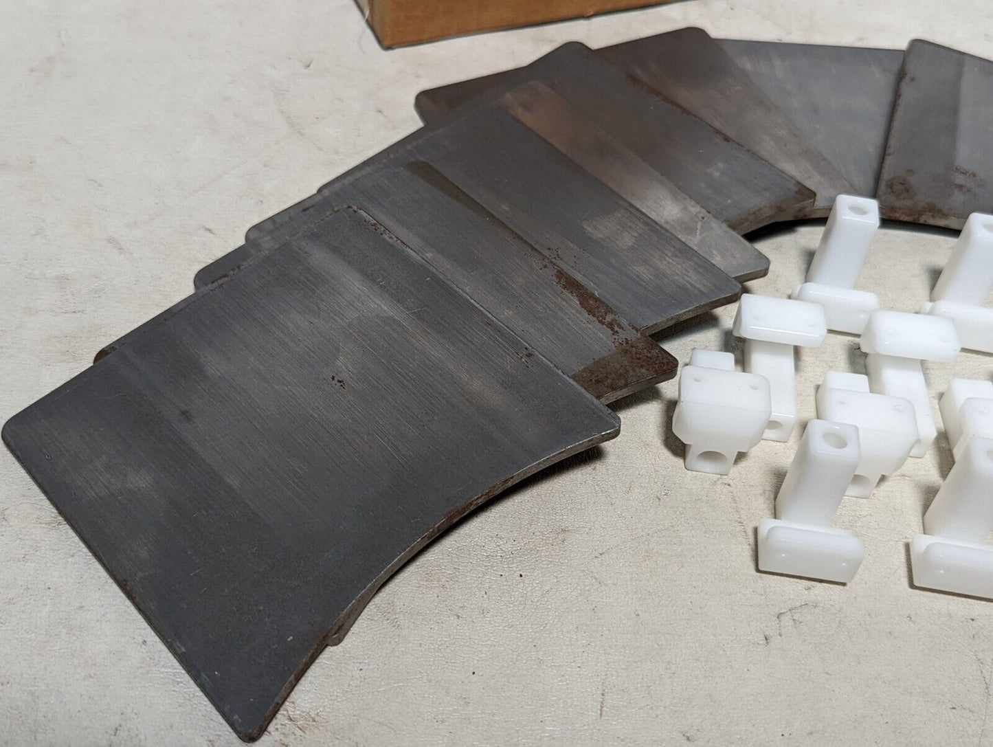 Signode 268362 track clips: twelve 5in by 4.25 in by 3/16 in steel plates