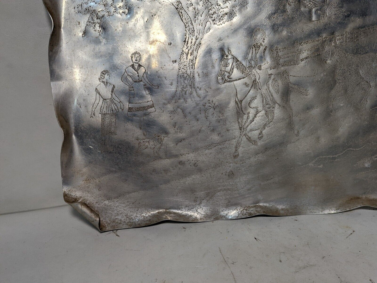 Handmade punched aluminum serving tray from 1951, horseback riding