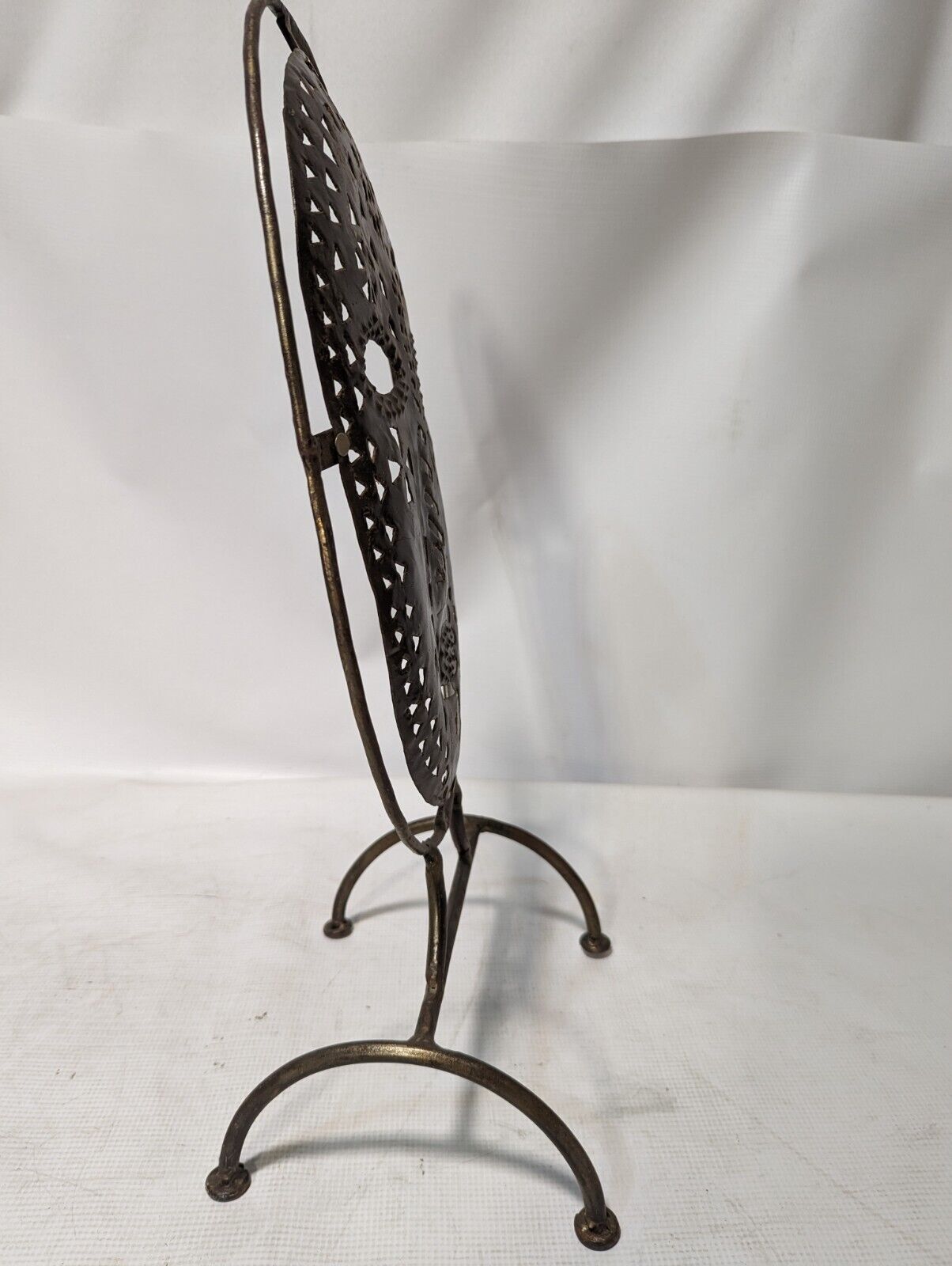 Metal mask on stand, 20.5 inches tall by 11 inches wide