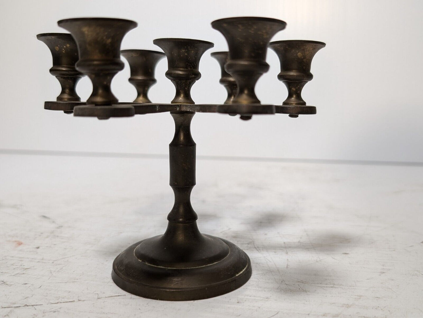 Vintage brass candelabra with seven candleholders, 4.5" tall x 5.5" in diameter