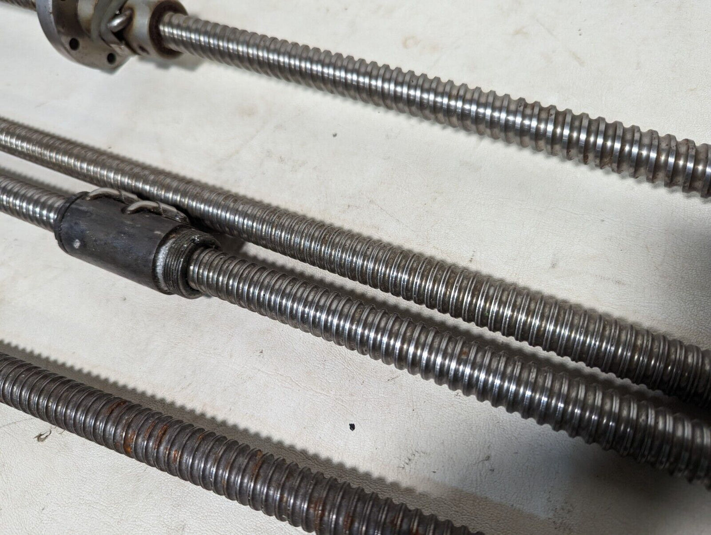 Lot of 4 feed screws, 3x 32 inches, 1x 36 inches long, plus some extras