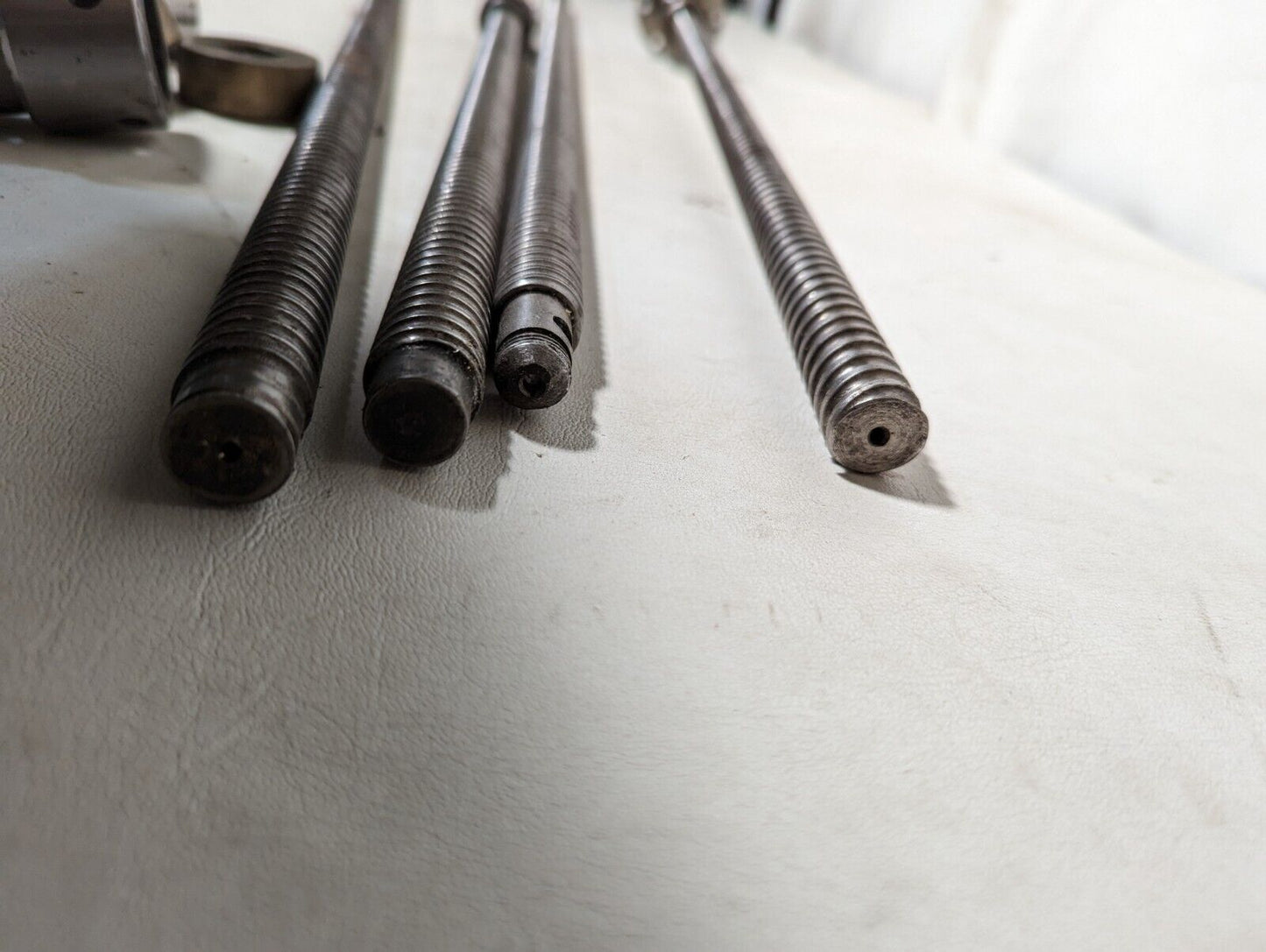 Lot of 4 feed screws, 3x 32 inches, 1x 36 inches long, plus some extras