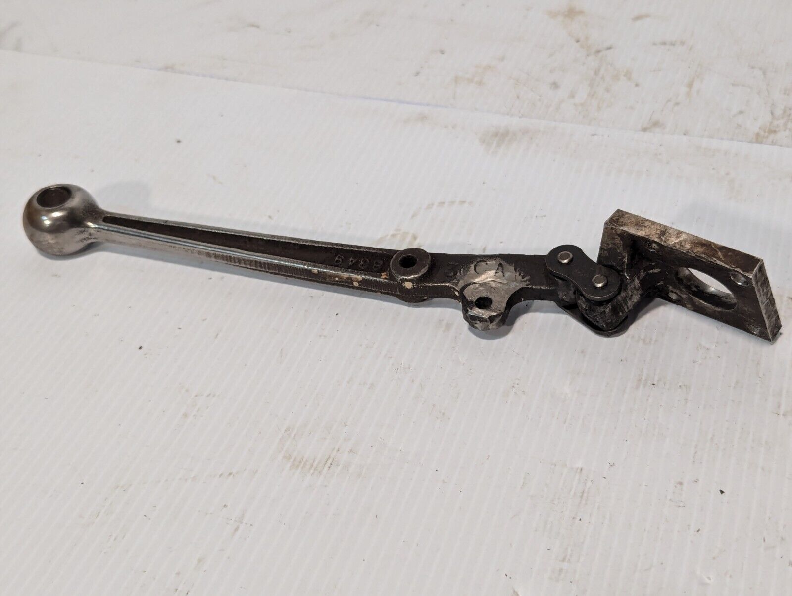 Steampunk 9.75 inch long steel handle with base, marked 8349, hinged