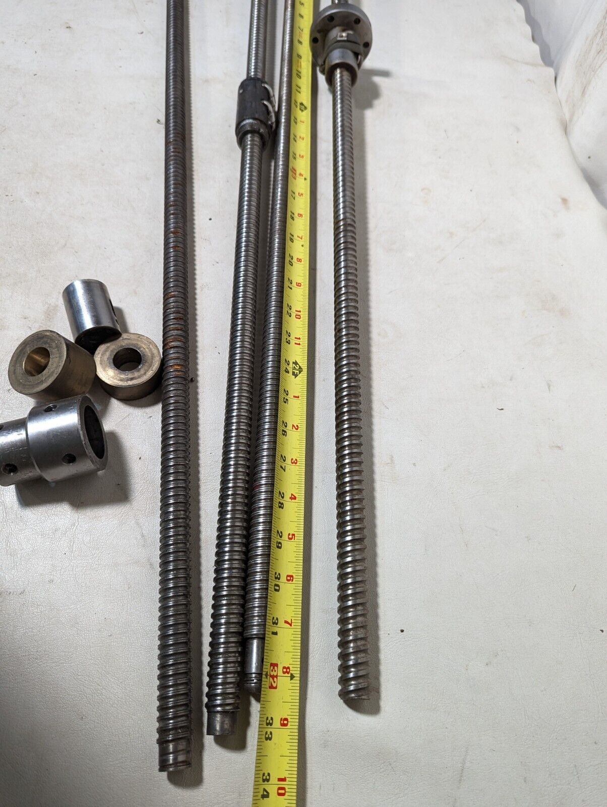 Lot of 4 feed screws, 3x 32 inches, 1x 36 inches long, plus some extras