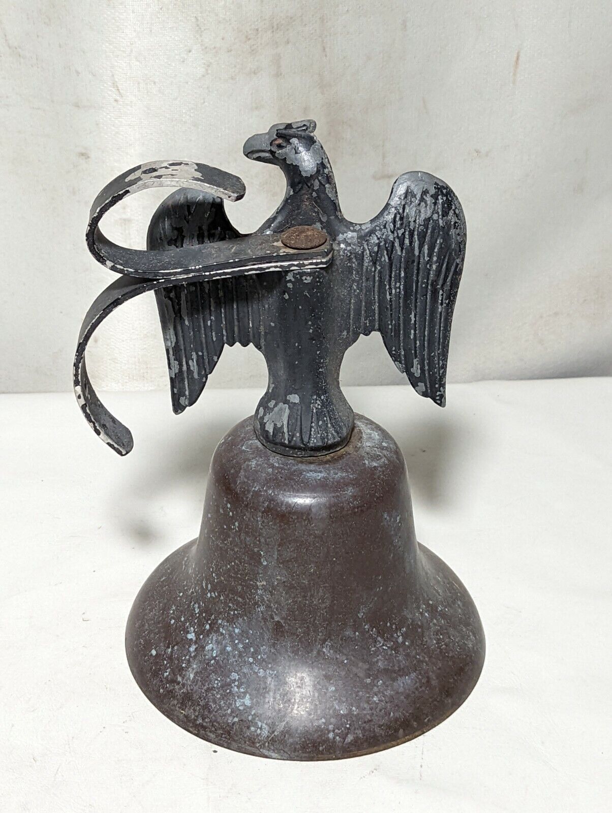 Weathered metal eagle bell
