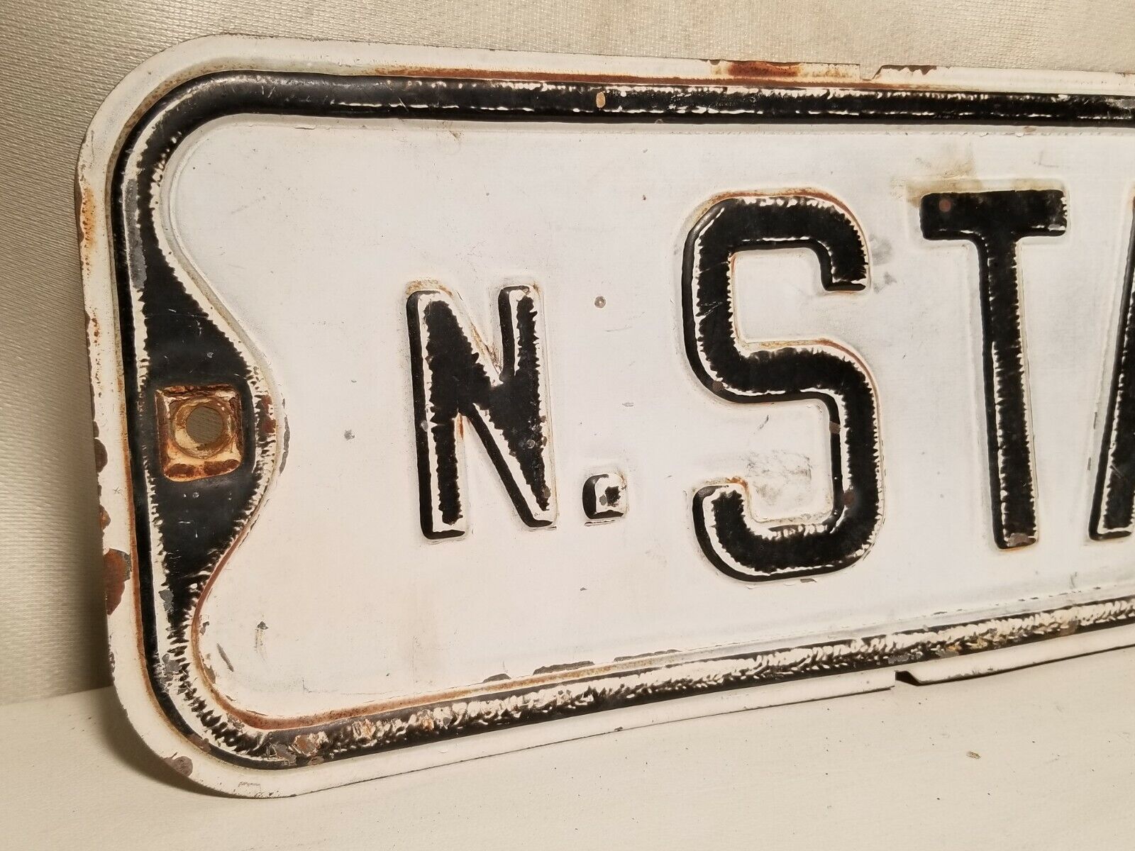 State Street Sign, North State, black and white, some rust, embossed