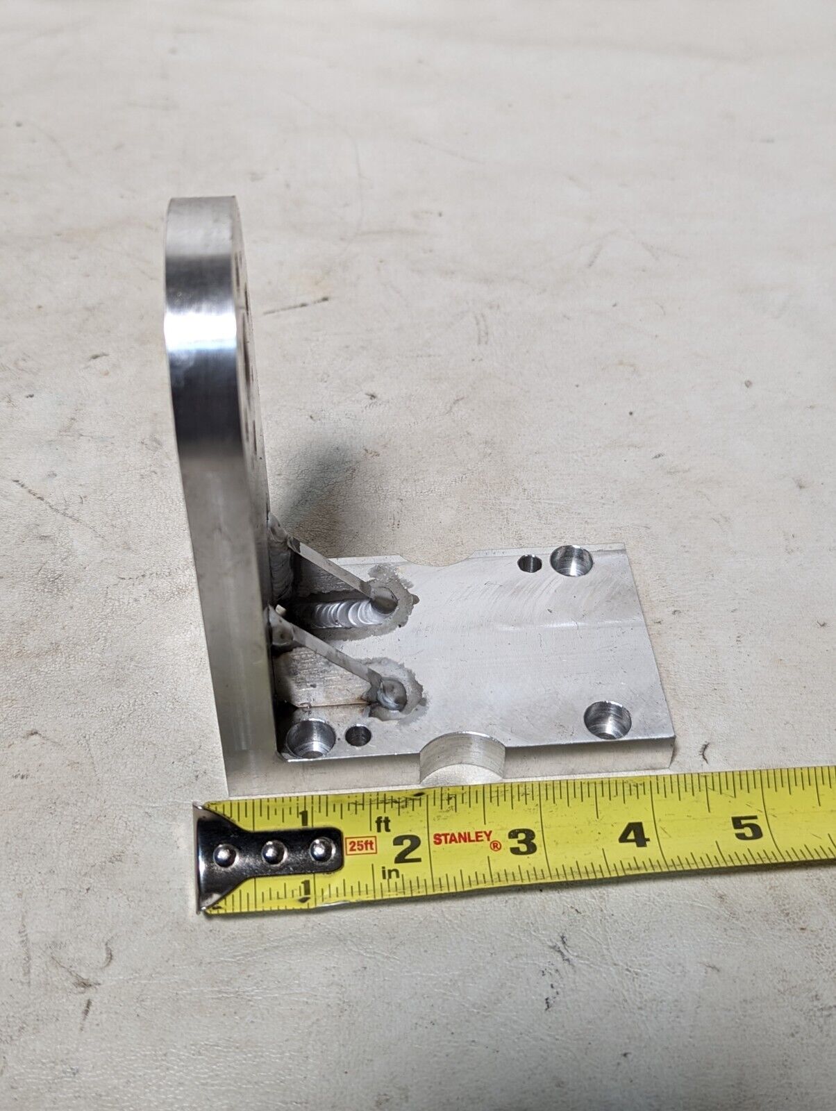 Aluminum right angle bracket, 5 in long, 4 in deep, 2.5 in wide, 0.5 in thick