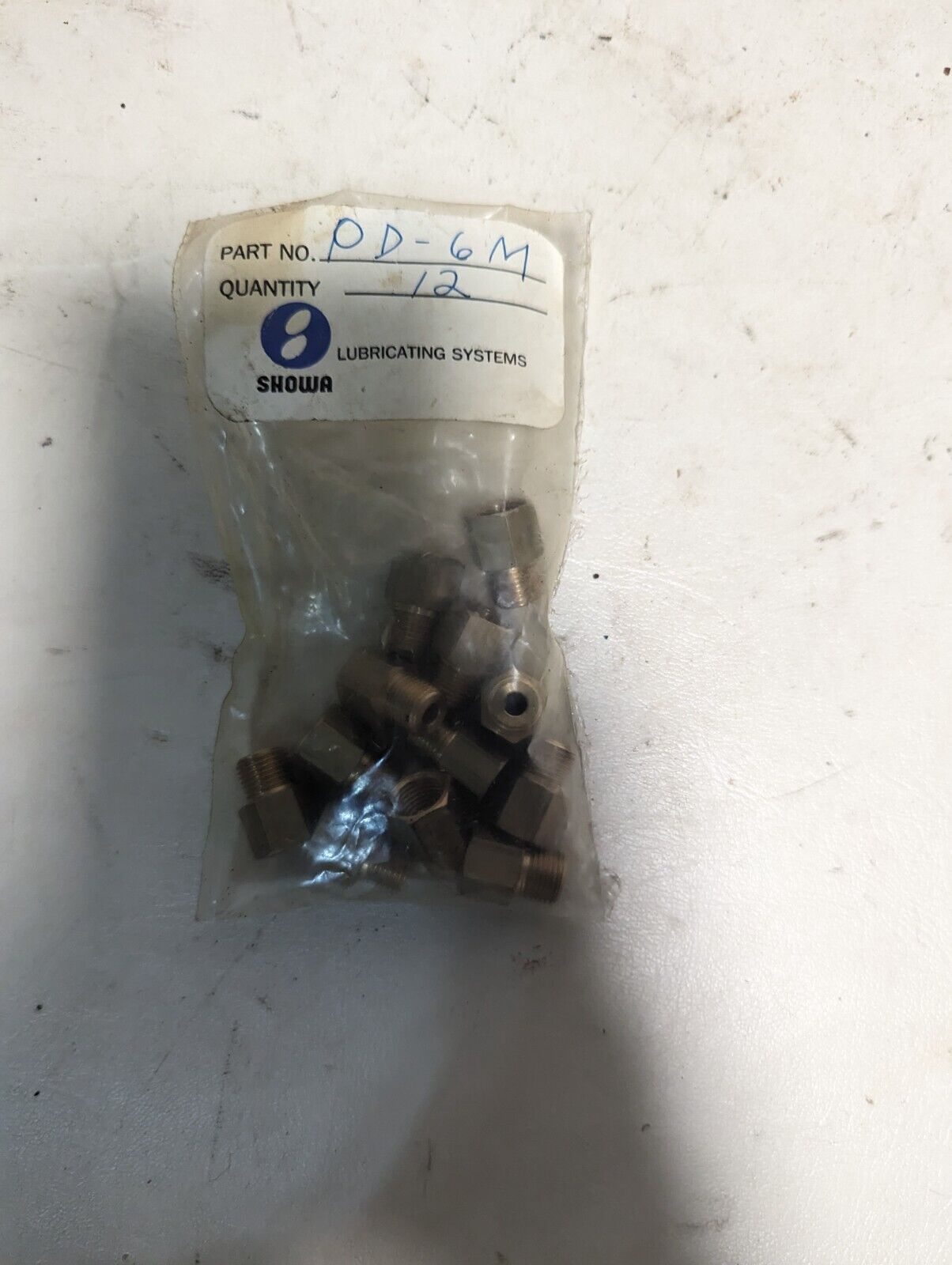 Lot of assorted Showa lubricating parts: two hoses, PB-6M, springs, PD-6M