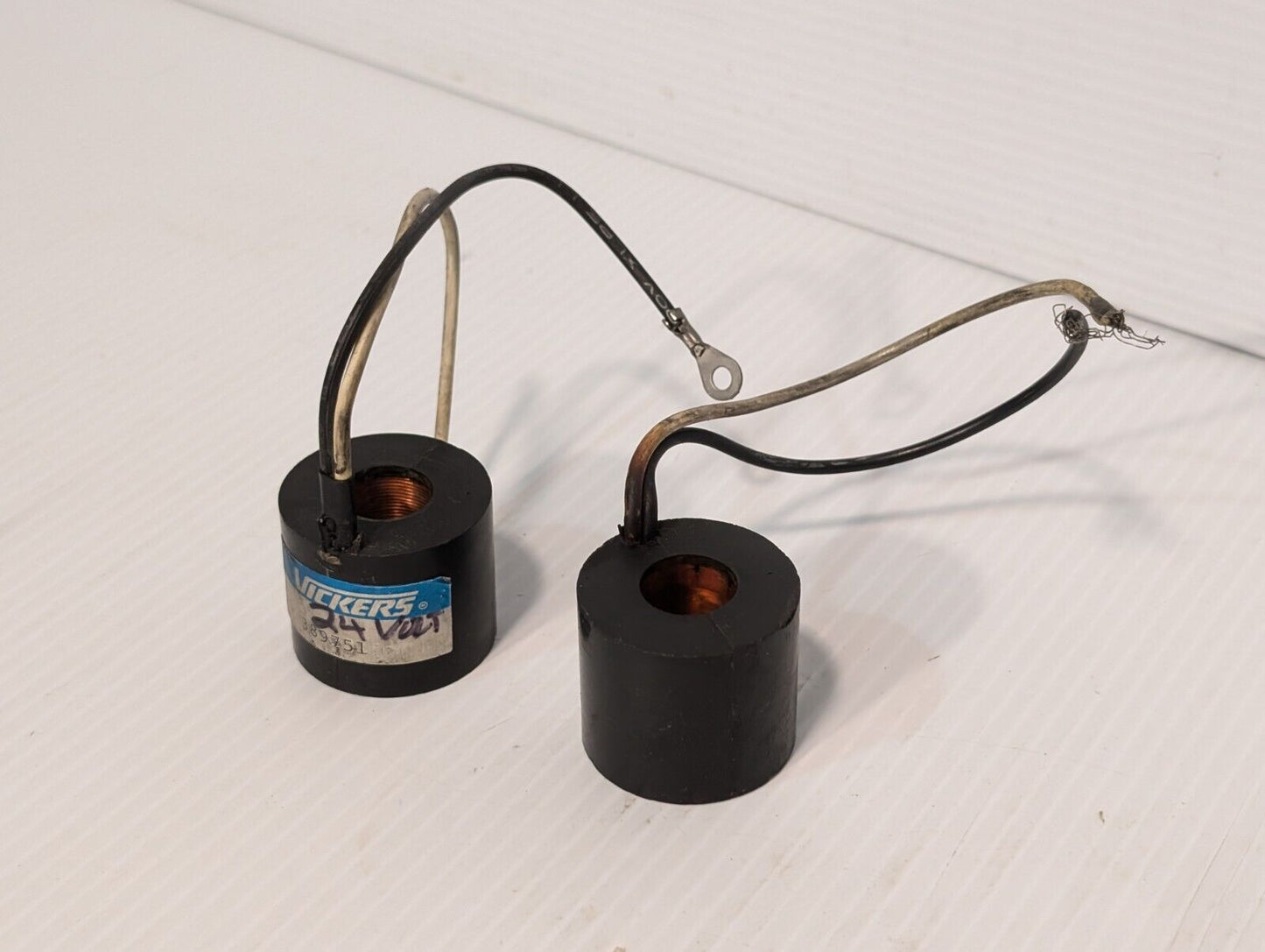 Vickers 389751 solenoid coil, 24V, and another presumably the same, but unmarked