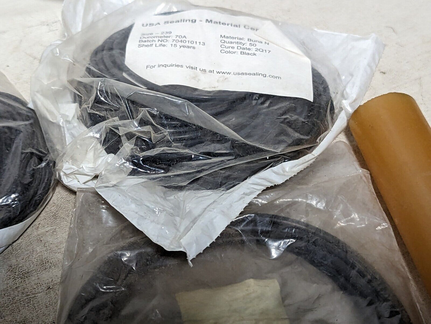 Lot of rubber, Buna N O-rings, rubber straps, and a rubbery cylinder...