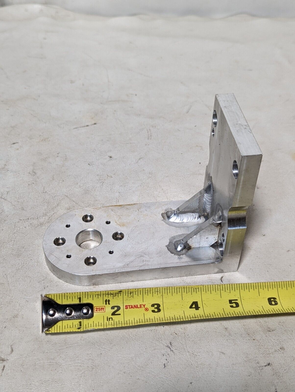 Aluminum right angle bracket, 5 in long, 4 in deep, 2.5 in wide, 0.5 in thick