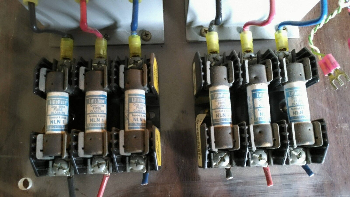 Two TimeMark B264 3-Phase Power Monitors mounted on plastic