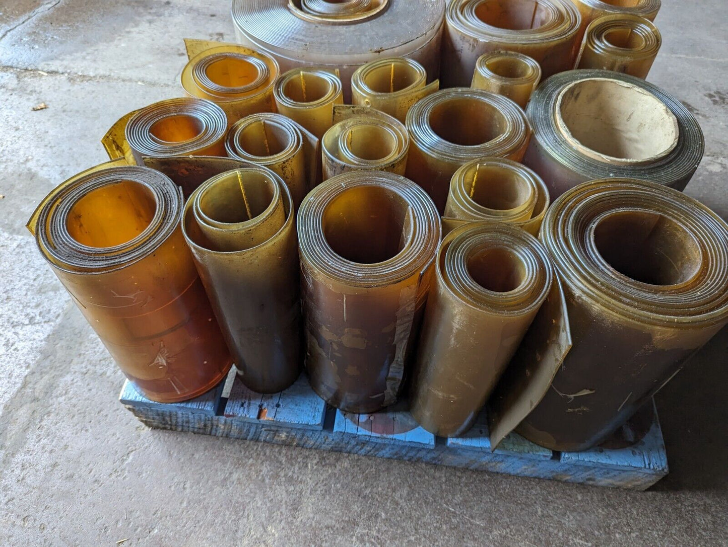 30in x 30in pallet full of 12 in wide plastic/PVC rolls as pictured