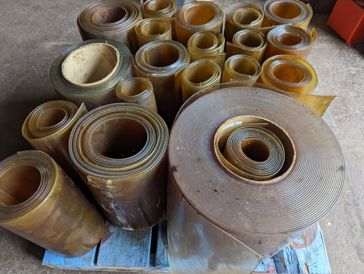 30in x 30in pallet full of 12 in wide plastic/PVC rolls as pictured