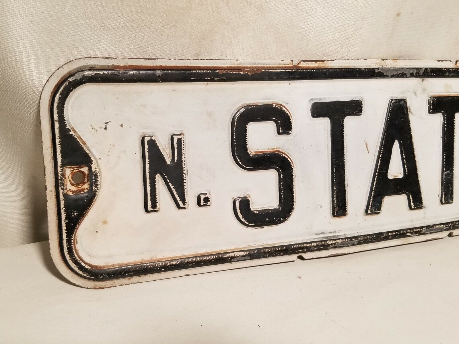 State Street Sign, North State, black and white, some rust, embossed
