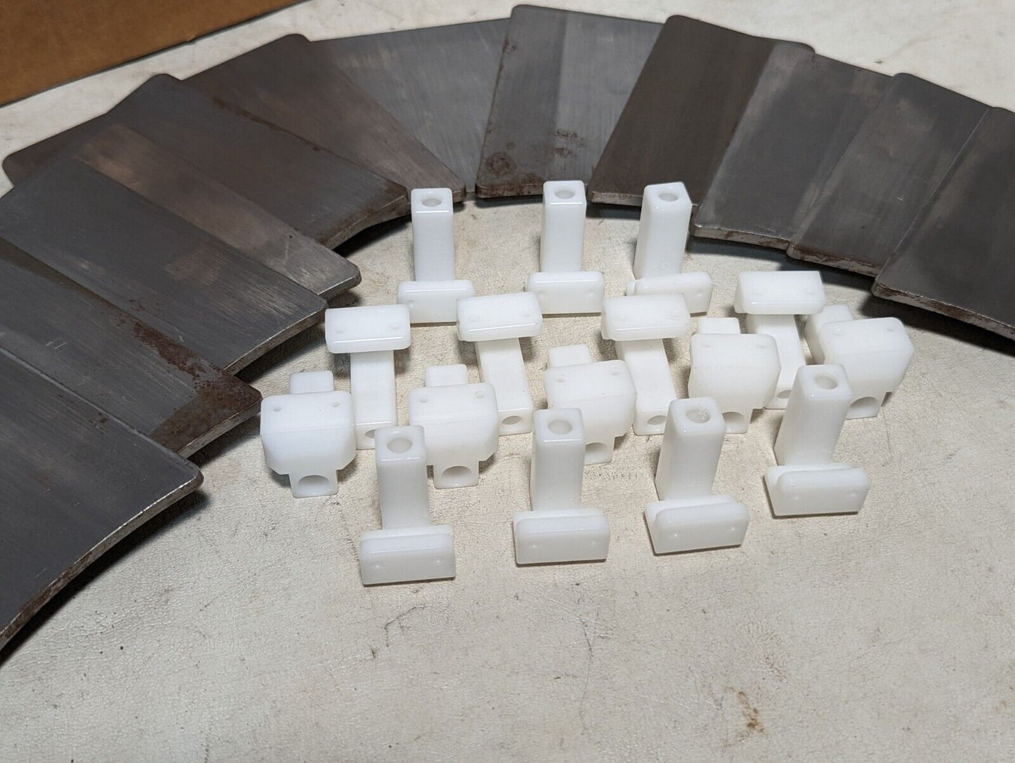 Signode 268362 track clips: twelve 5in by 4.25 in by 3/16 in steel plates