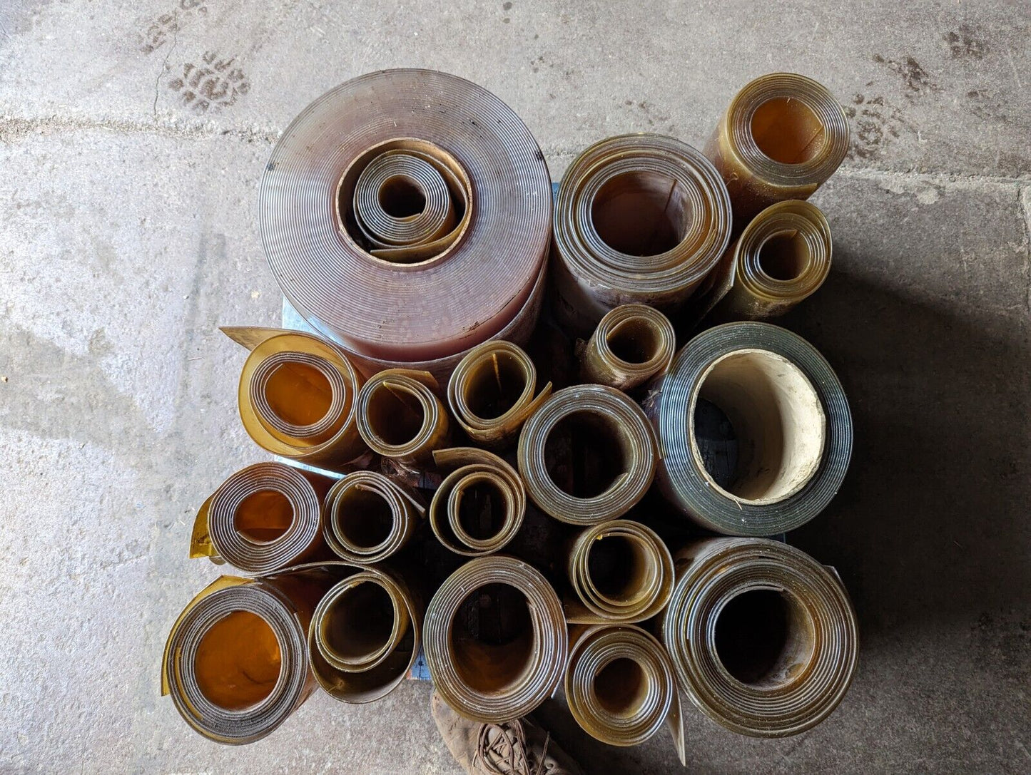 30in x 30in pallet full of 12 in wide plastic/PVC rolls as pictured