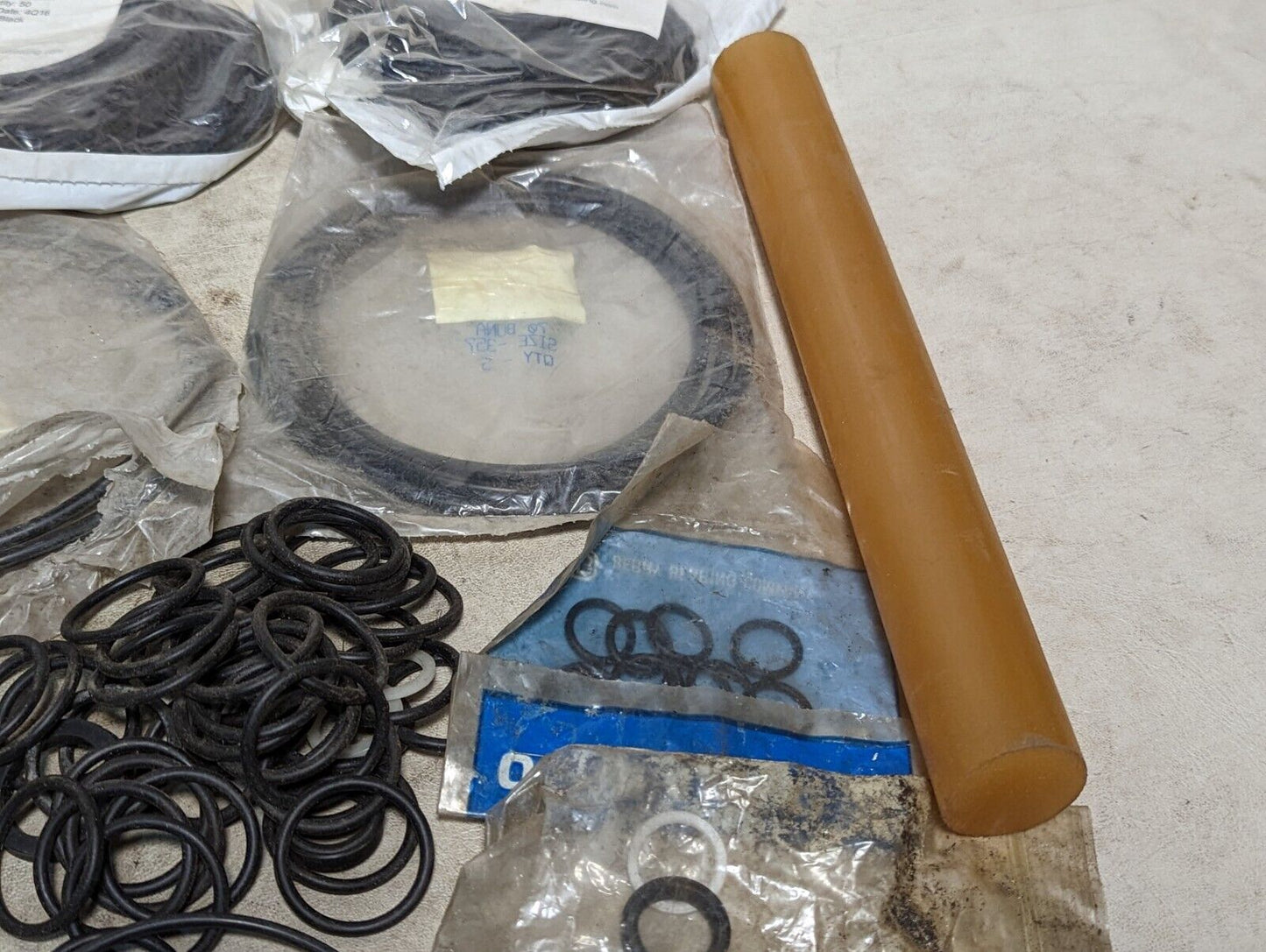 Lot of rubber, Buna N O-rings, rubber straps, and a rubbery cylinder...