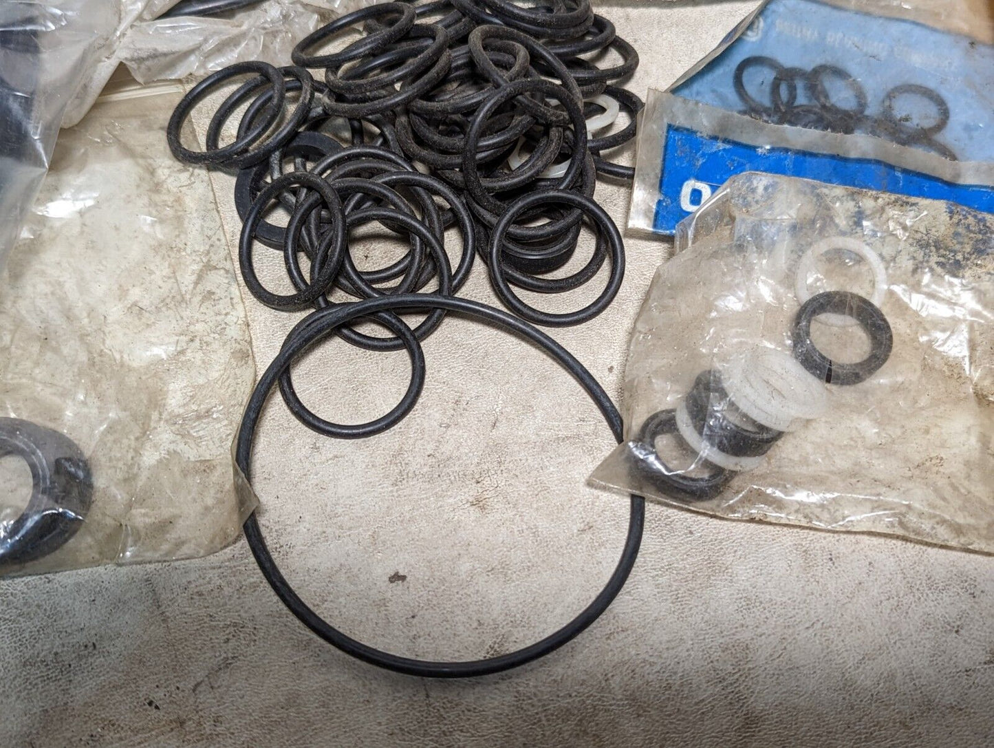 Lot of rubber, Buna N O-rings, rubber straps, and a rubbery cylinder...
