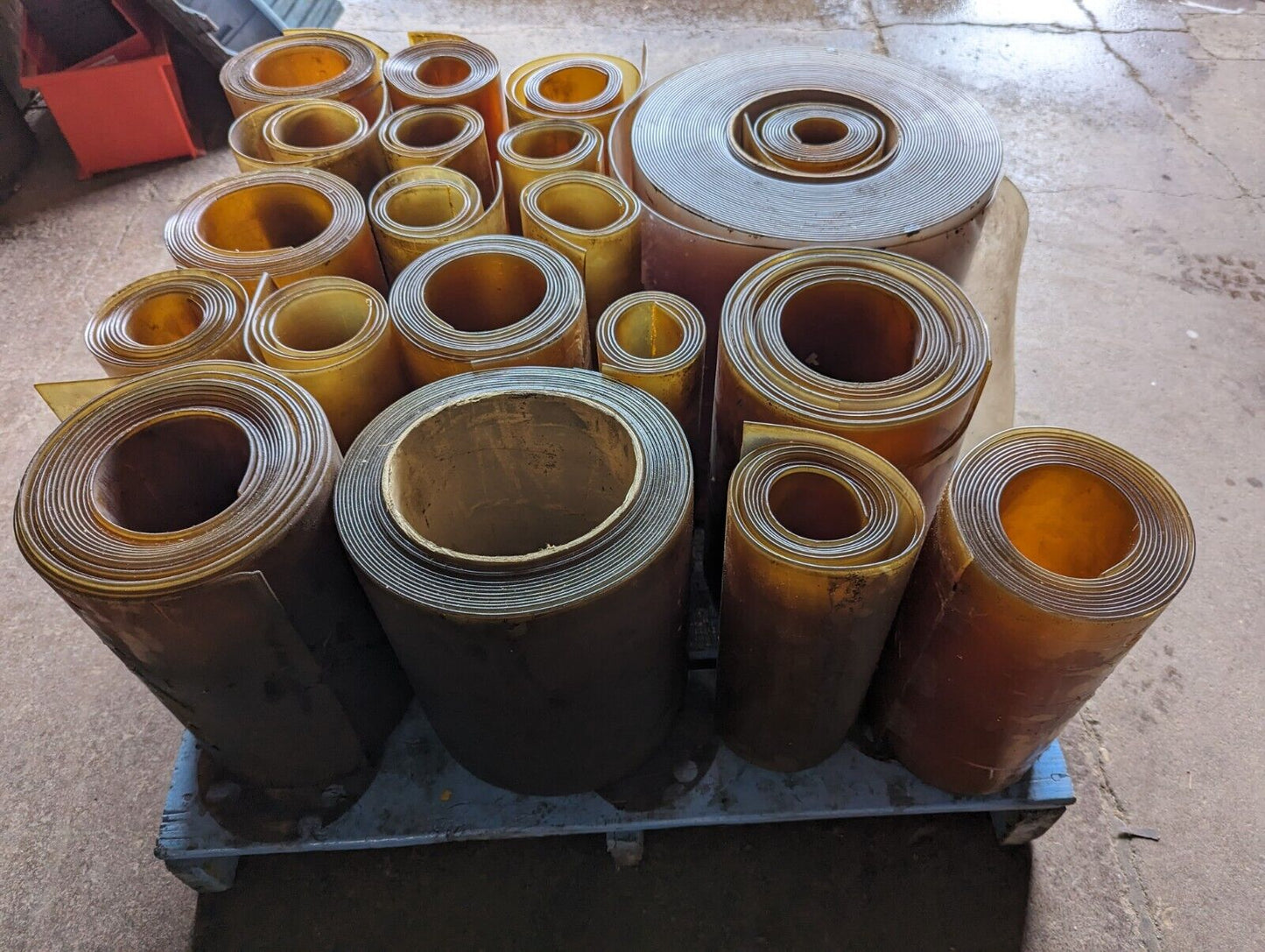 30in x 30in pallet full of 12 in wide plastic/PVC rolls as pictured