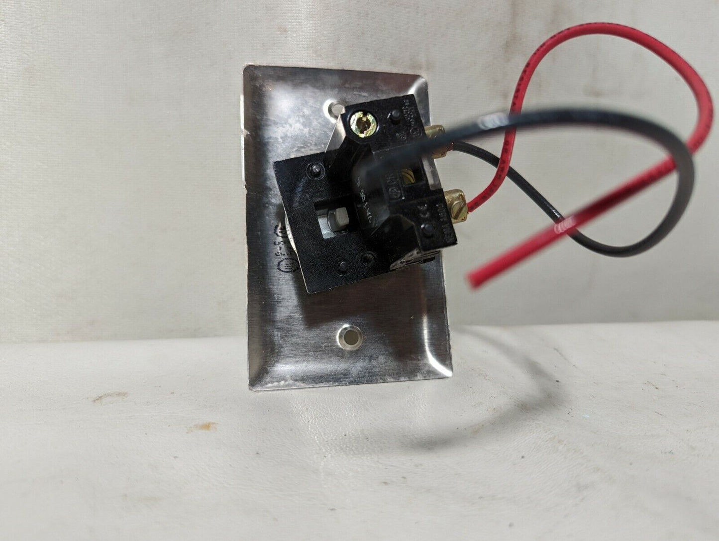 Lot of 2 GE CR104P red pushbutton switches mounted on stainless steel cover plat