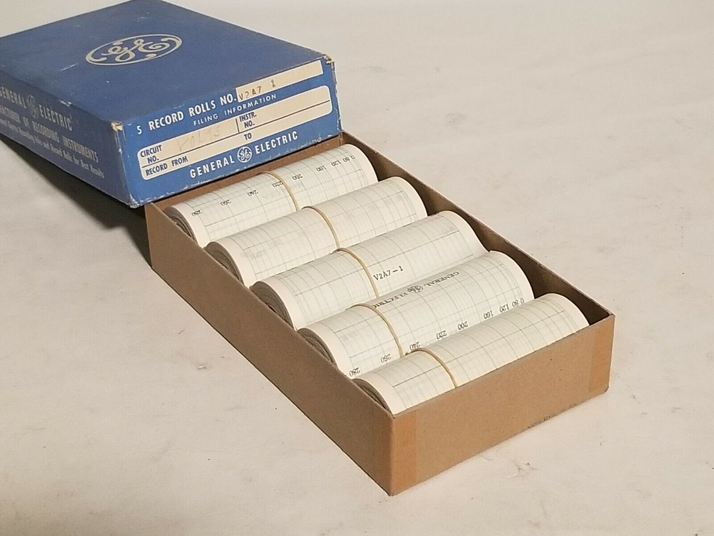 2 boxes of GE record rolls V2A71 (volts) and 303A1 (amps), 5 rolls per box