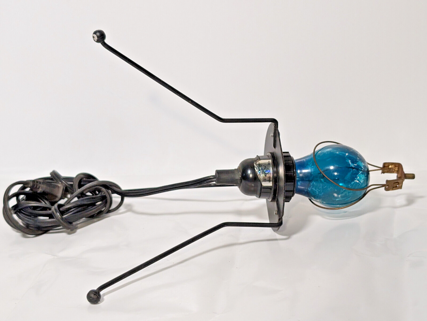 Vintage 1980s blue bulb, black metal, stilt lamp, minimalist, post-modern, pop