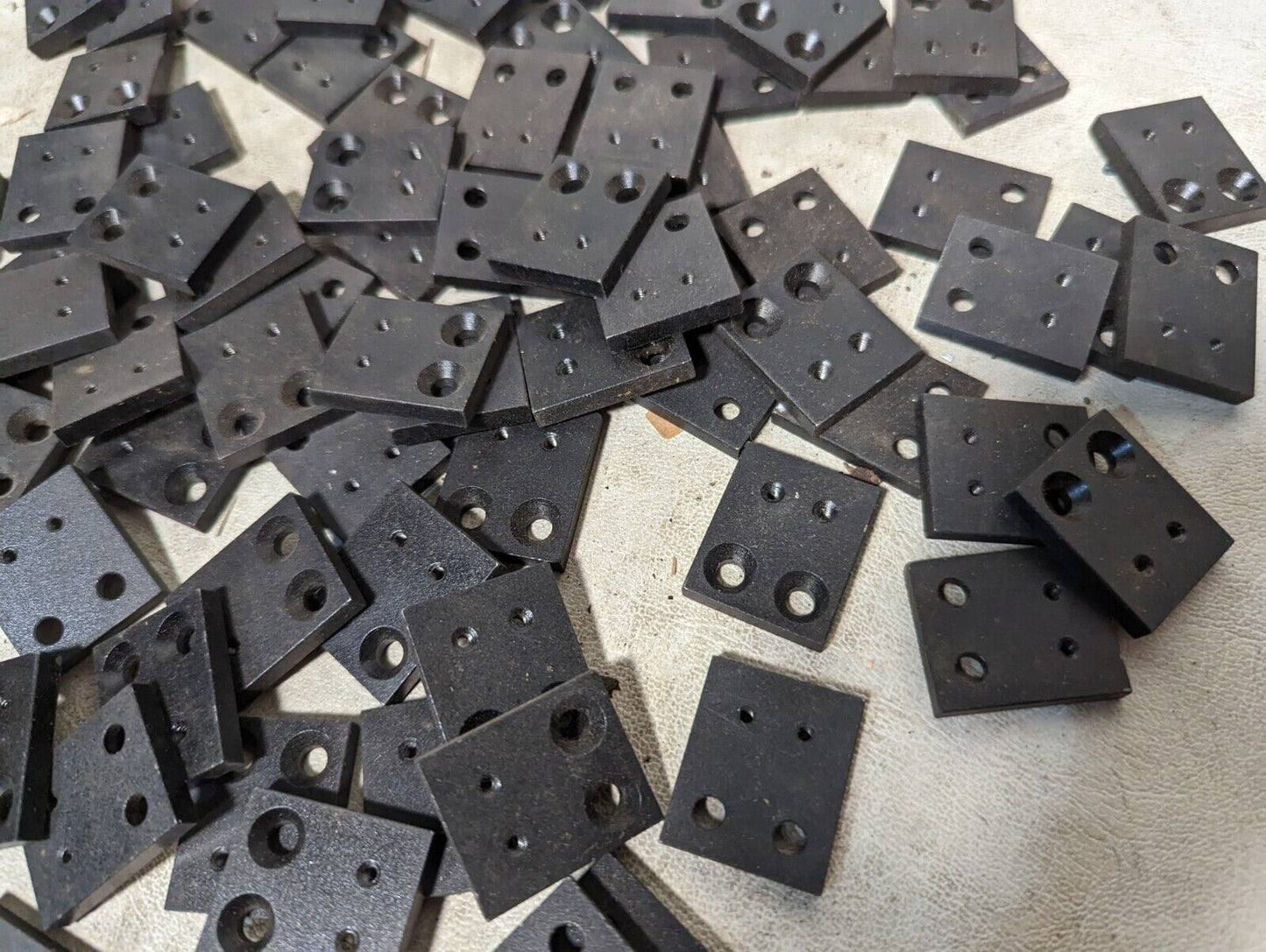 6.5+ pounds of flat metal bracket plates as pictured, 0.19 inches thick...