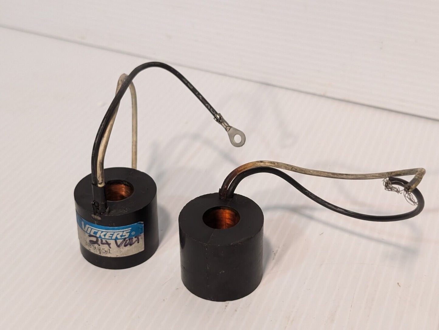 Vickers 389751 solenoid coil, 24V, and another presumably the same, but unmarked