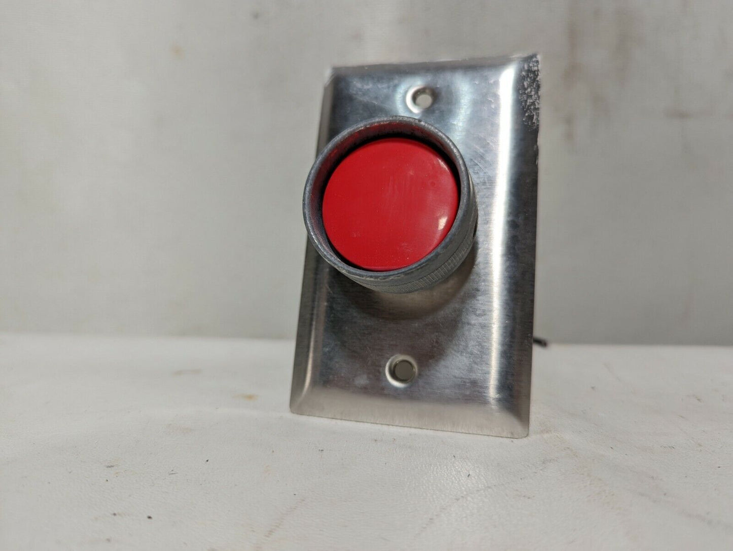 Lot of 2 GE CR104P red pushbutton switches mounted on stainless steel cover plat