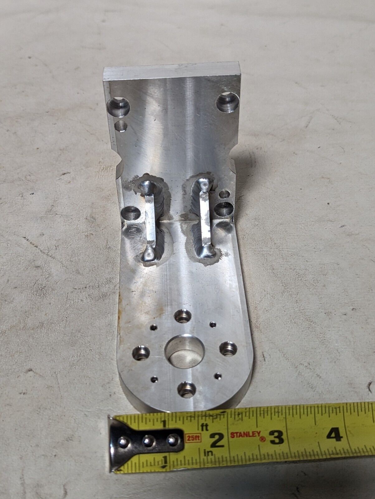 Aluminum right angle bracket, 5 in long, 4 in deep, 2.5 in wide, 0.5 in thick