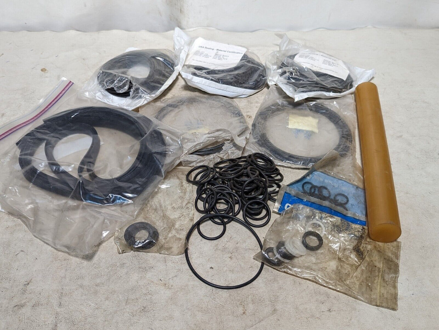 Lot of rubber, Buna N O-rings, rubber straps, and a rubbery cylinder...