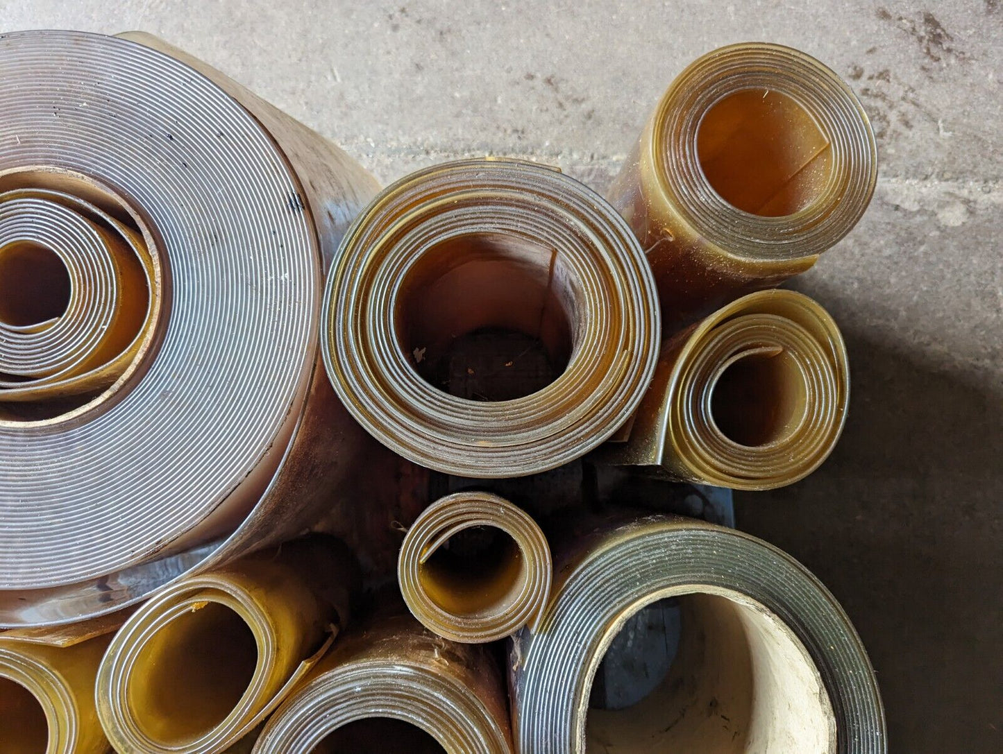 30in x 30in pallet full of 12 in wide plastic/PVC rolls as pictured
