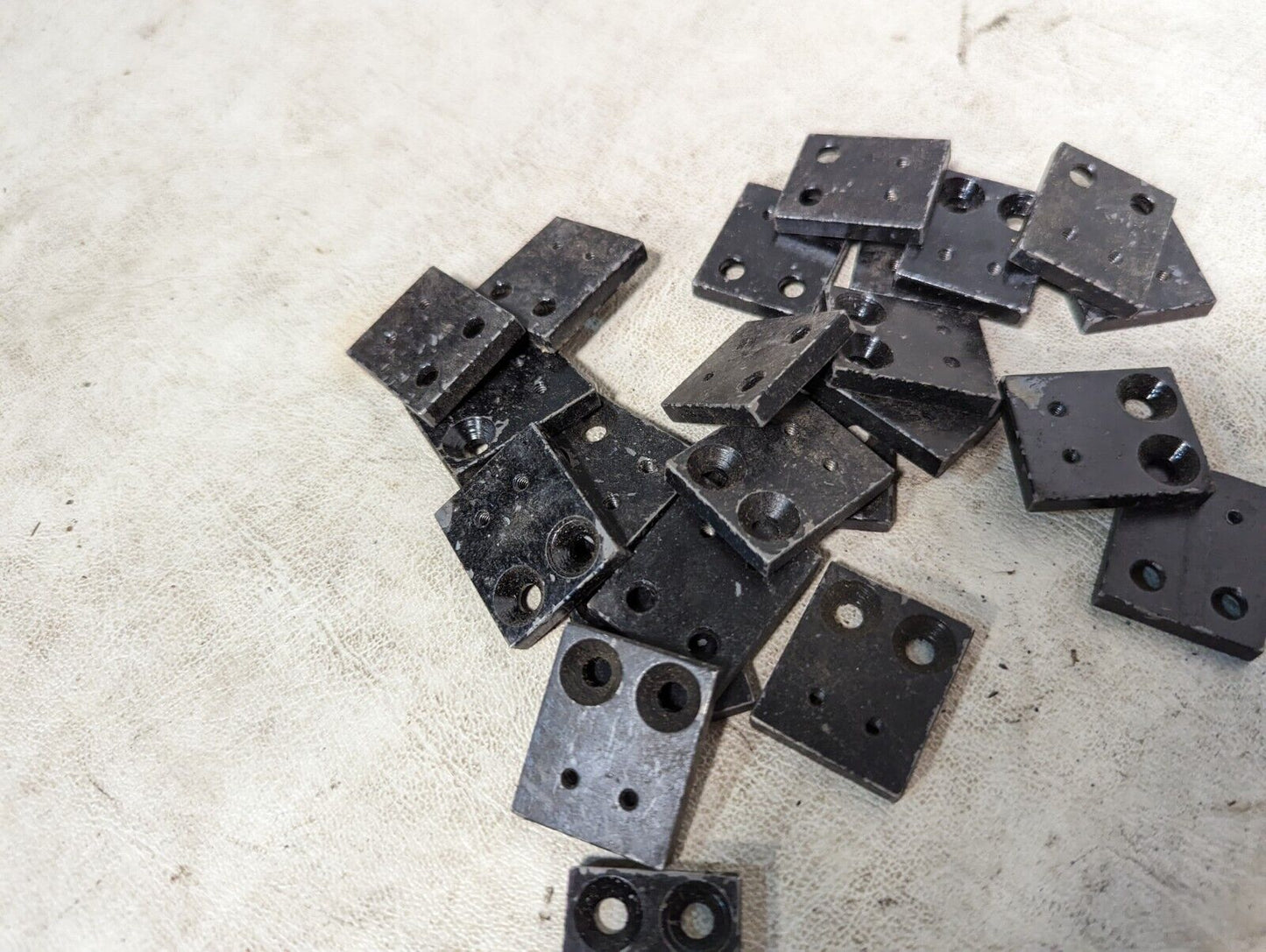 6.5+ pounds of flat metal bracket plates as pictured, 0.19 inches thick...