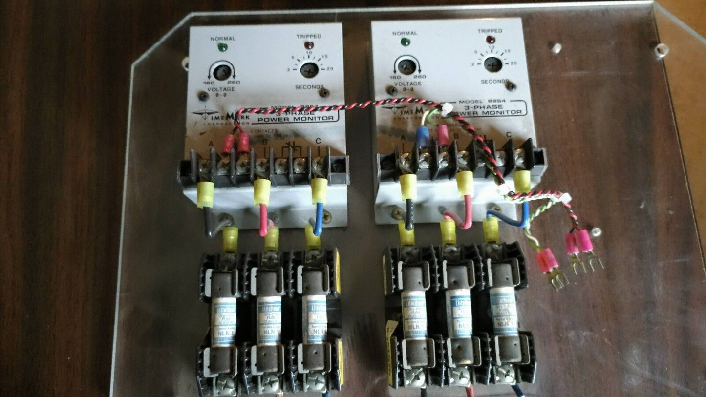 Two TimeMark B264 3-Phase Power Monitors mounted on plastic