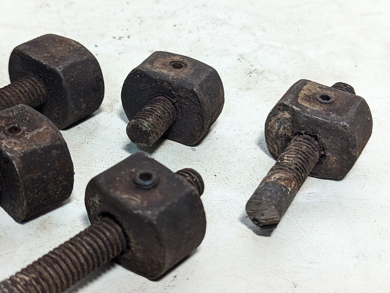 Lot of 8 rusty sawed-off threaded rods with set screw stops as pictured