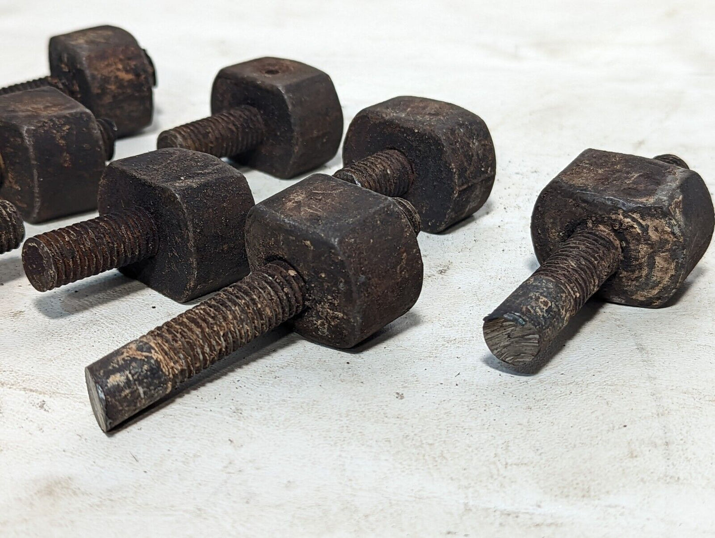 Lot of 8 rusty sawed-off threaded rods with set screw stops as pictured
