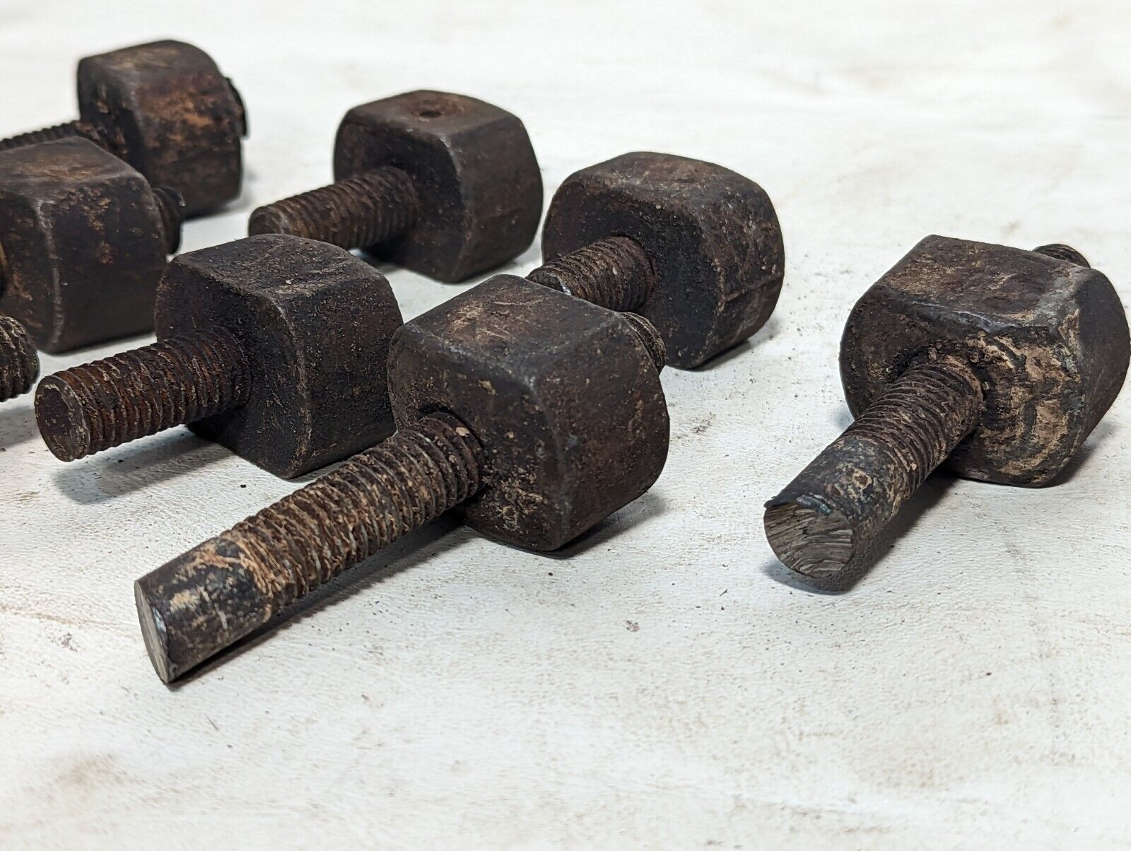 Lot of 8 rusty sawed-off threaded rods with set screw stops as pictured