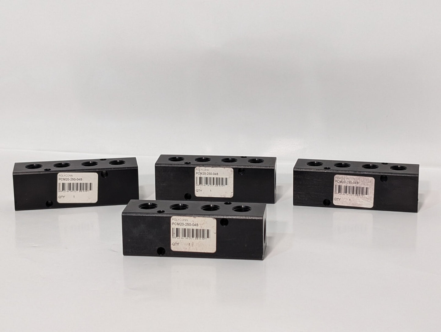 (4) Polyconn PCM20-250-04B Pneumatic Manifold 4x 1/4" NPT Out 3/8" NPT In