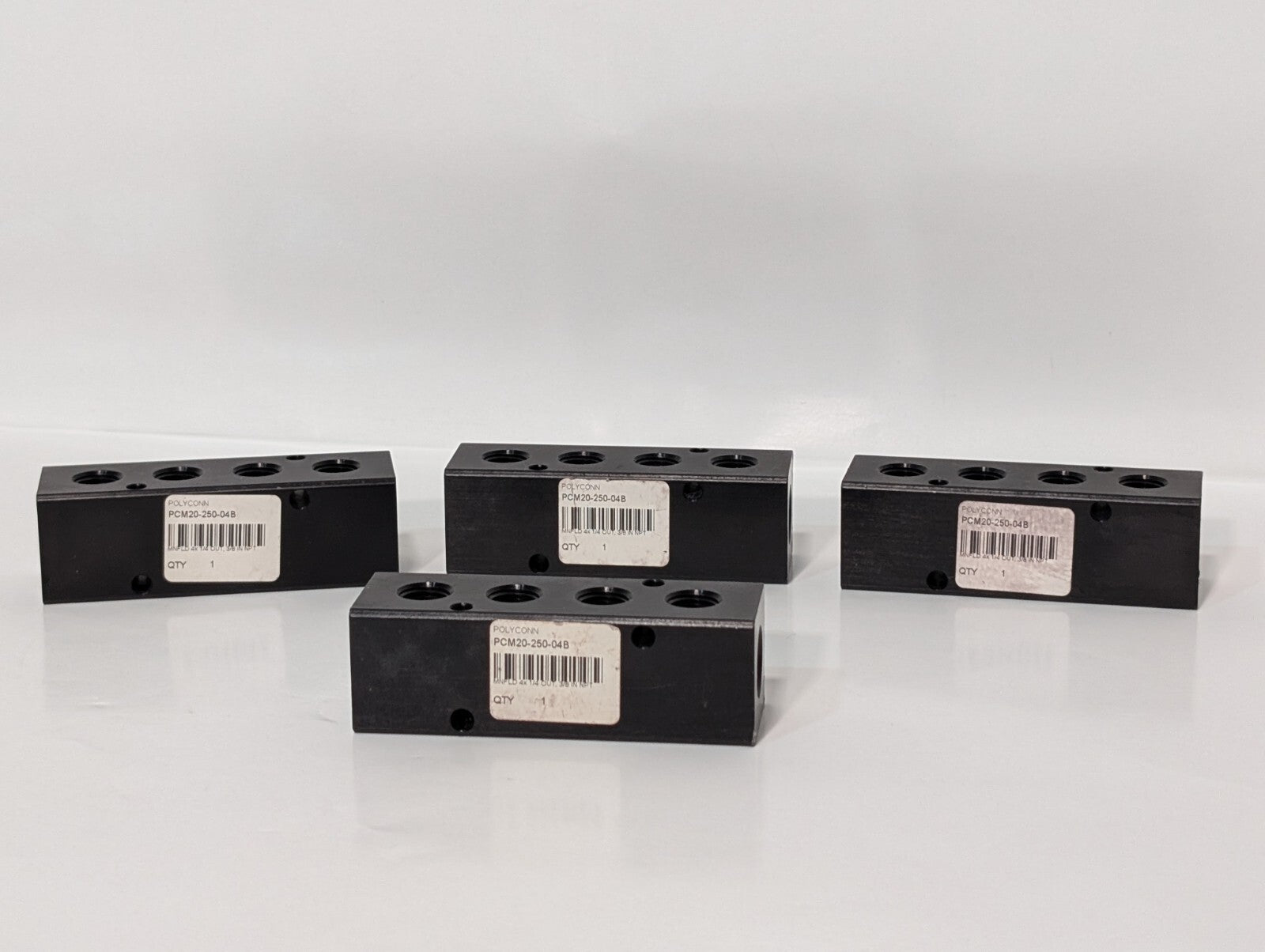 (4) Polyconn PCM20-250-04B Pneumatic Manifold 4x 1/4" NPT Out 3/8" NPT In