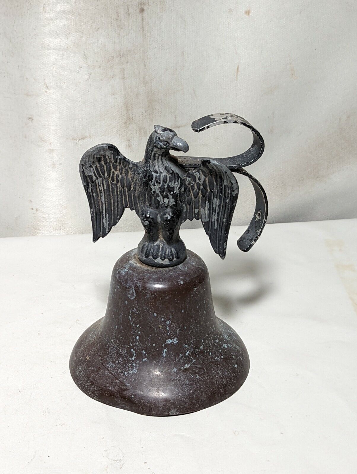 Weathered metal eagle bell